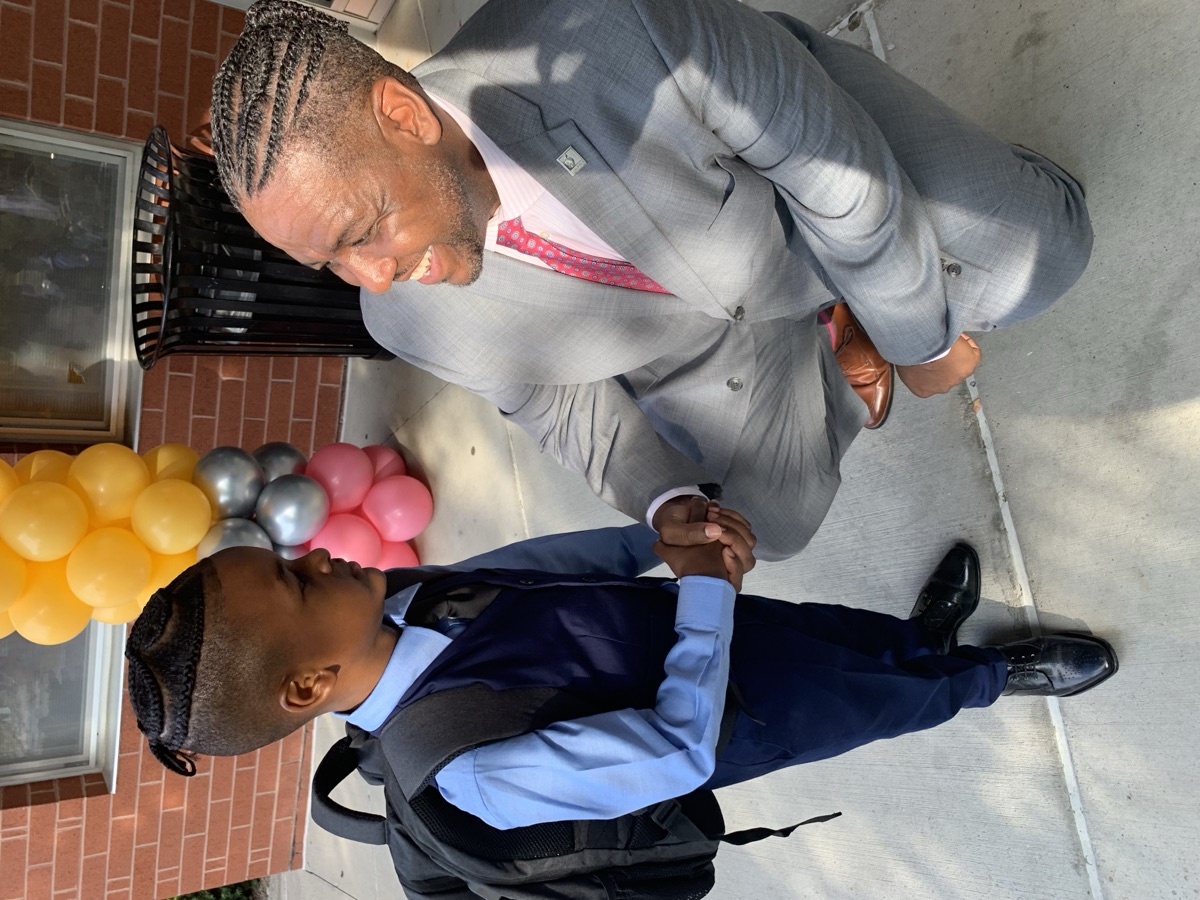 Dr. Grubbs mentoring a student at a school event